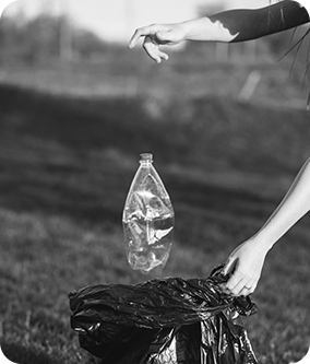 throwing a plastic bottle in the trash